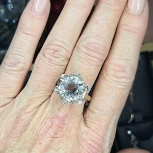 White Topaz Halo Ring In Platinum Over 925 Sterling Silver.